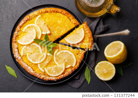 Delicious lemon tart with golden crust and smooth, glossy lemon filling 131377244