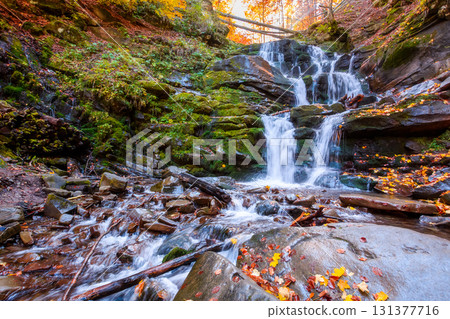 beautiful autumn landscape with waterfall shypit. popular destination in carpathian mountains of ukraine. forest in golden leaves. amazing sunny weather during fall season beautiful autumn landscape with waterfall shypit. popular destination in carpathian mountains of ukraine. forest in golden leaves. amazing sunny weather during fall season 131377716