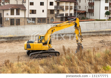 Excavator leveling ground for park construction 131377771