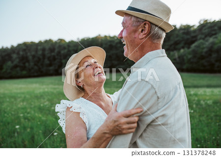 Elderly man and woman spending time in nature. 131378248