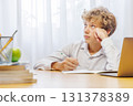 Schoolboy studying at home, doing homework 131378389