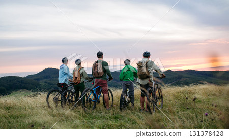 Multigenerational family on cycling trip in nature. 131378428