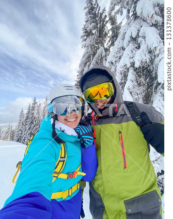 Couple Taking Selfie on Snowy Mountain Couple Taking Selfie on Snowy Mountain 131378600