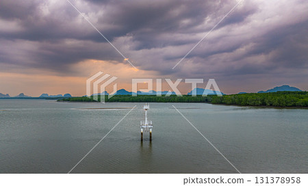 Aerial view of lighthouse in cloudy sky Aerial view of lighthouse in cloudy sky 131378958