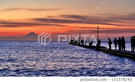 People enjoying the sunset at Haraoka Pier in Minamiboso City, Chiba Prefecture People enjoying the sunset at Haraoka Pier in Minamiboso City, Chiba Prefecture 131379243