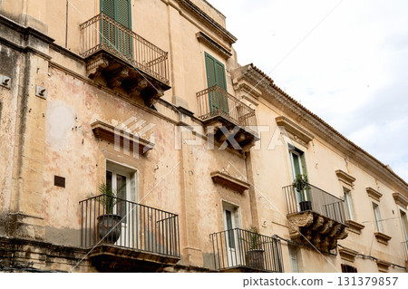 Historic italian building facade with traditional balcony Historic italian building facade with traditional balcony 131379857