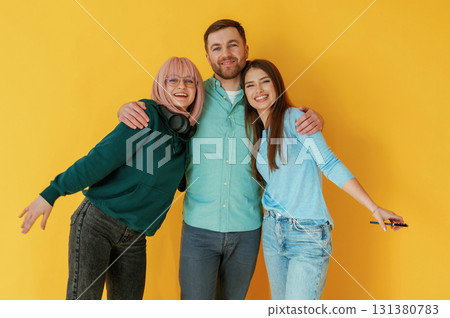 Front view. Group of friends are in the studio against background 131380783