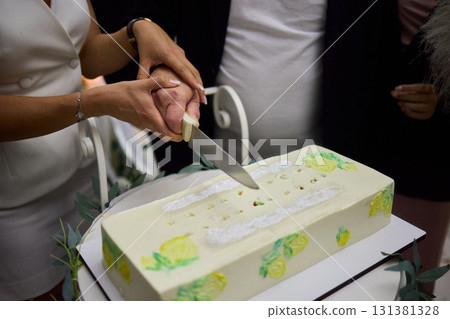An Elegant Cake Cutting Ceremony at a Celebration Event, full of joy and excitement 131381328