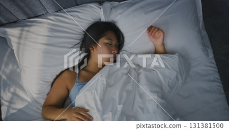 Young Girl Sleeping in Bed in Bright, Sun-filled Bedroom Young Girl Sleeping in Bed in Bright, Sun-filled Bedroom 131381500