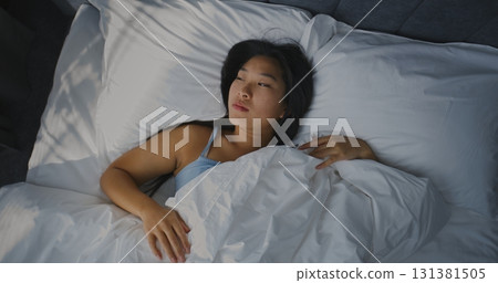 Young Girl Wakes Up Early in Morning in Bedroom Young Girl Wakes Up Early in Morning in Bedroom 131381505