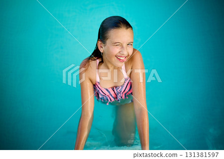 Teen girl enjoys summer in the pool, showcasing joy while relaxing in the water with a big smile Teen girl enjoys summer in the pool, showcasing joy while relaxing in the water with a big smile 131381597