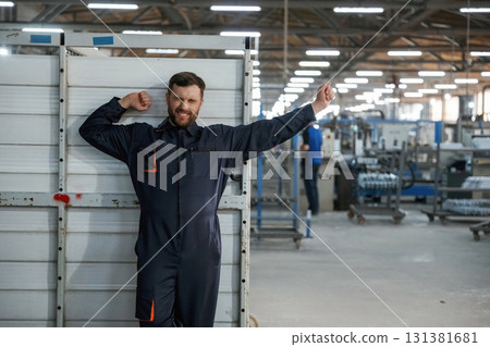 Feeling sleepy, taking a break. Factory worker is indoors Feeling sleepy, taking a break. Factory worker is indoors 131381681