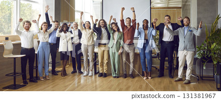 Group portrait of happy business team rejoicing in successful results of company. 131381967
