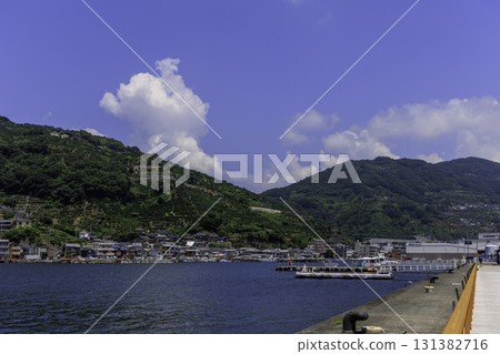Summer scenery of Yawatahama Port in Ehime Prefecture, surrounded by blue skies and green mountains Summer scenery of Yawatahama Port in Ehime Prefecture, surrounded by blue skies and green mountains 131382716