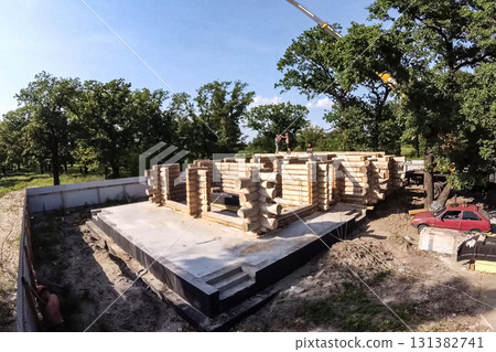 Stage of construction of a wooden house. 131382741