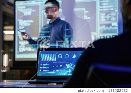 Talking about project. Male business trainer is against projector with data, teaching people Talking about project. Male business trainer is against projector with data, teaching people 131382982