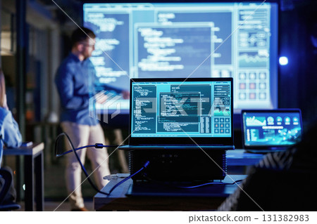 Male business trainer is against projector with data, teaching people Male business trainer is against projector with data, teaching people 131382983