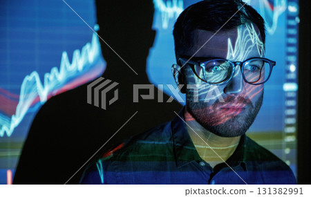 Front view, portrait. Business coach against projector with data 131382991