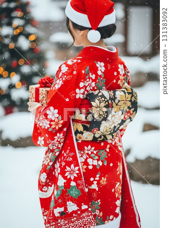 A woman wearing a Christmas-patterned kimono 131383092