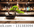 A bar counter with a pine bonsai 131383094