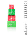 Pile of red and green wrapped gift boxes tied with white string, isolated on white background with reflection. Stock photo. 131383104