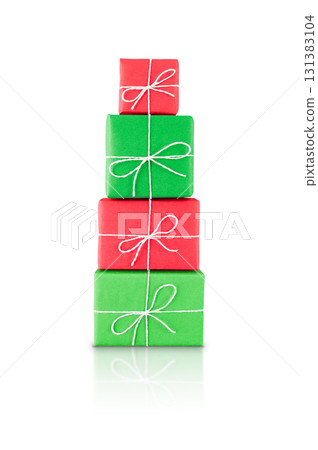 Pile of red and green wrapped gift boxes tied with white string, isolated on white background with reflection. Stock photo. Pile of red and green wrapped gift boxes tied with white string, isolated on white background with reflection. Stock photo. 131383104
