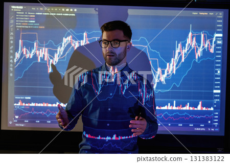 Professional trainer. Business coach against projector with data 131383122