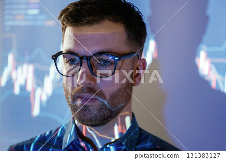 Close up portrait. Business coach against projector with data 131383127