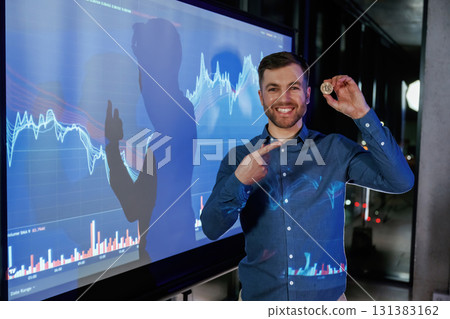 Coin of digital currency in hand. Business coach against projector with data 131383162