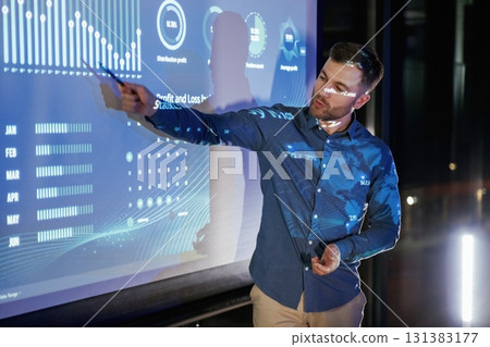 Statistics on the screen. Business coach against projector with data 131383177