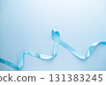 Men's health and Prostate cancer awareness campaign in November. Light blue ribbon awareness on sky blue background. Symbol for support men who living with cancer. Copy space. 131383245