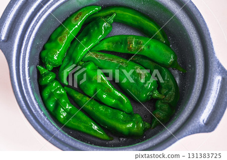Grilled Manganji peppers 131383725