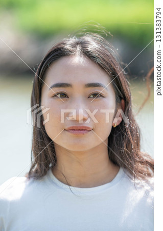 Woman relaxing by the river 131383794