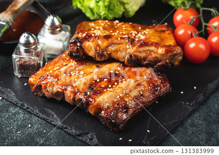 Barbecue pork spare ribs with hot honey chili marinade on black background 131383999