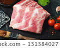 Raw meat. Raw pork ribs from the back with meat on a black background. background image 131384027