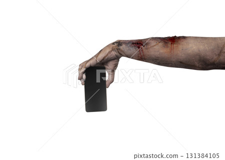 The zombies hand with wounds and blood holding a cellphone isolated over a white background. Zombie, devil, evil, satan, or monster hand. Mockup or Copy space. Concept of Halloween or Horror 131384105