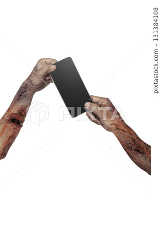 The zombies hand with wounds and blood holding a cellphone isolated over a white background. Zombie, devil, evil, satan, or monster hand. Mockup or Copy space. Concept of Halloween or Horror The zombies hand with wounds and blood holding a cellphone isolated over a white background. Zombie, devil, evil, satan, or monster hand. Mockup or Copy space. Concept of Halloween or Horror 131384108