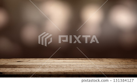 Rustic wooden table surface with blurred brown background. Mockup, template, or copy space. Product display and promotional content 131384127