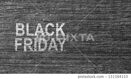 Closeup view of Black Friday text on a wooden background. Copy space. Flat lay. Black Friday sale concept 131384133
