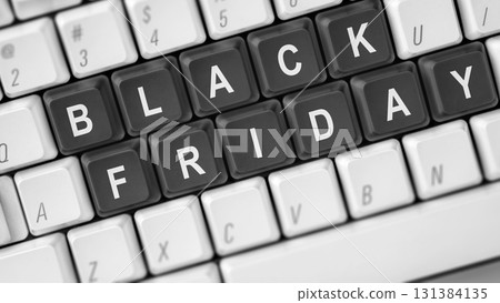 Closeup view of Black Friday text on the computer keyboard button. Copy space. Black Friday sale concept 131384135