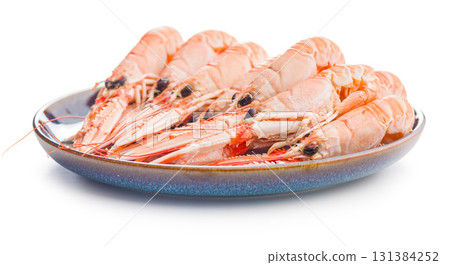 Scampi langoustine on plate isolated on white background. 131384252