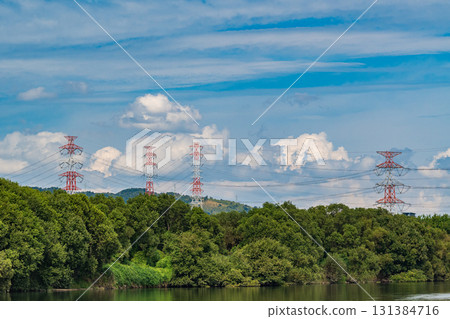 Power line tower standing on the banks of the Yodo River, Takatsuki City, Osaka Prefecture 131384716