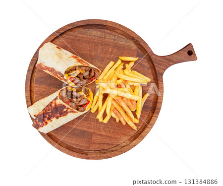meat shawarma and French fries on wooden round stand, isolated on white background with clipping path meat shawarma and French fries on wooden round stand, isolated on white background with clipping path 131384886