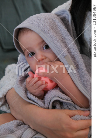 Mother and Baby Bonding with Glowing Toy 131384967