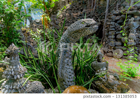 A snake's head made of shells. A snake's head made of shells. 131385053