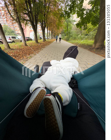 Baby in Stroller on Tree-Lined Sidewalk Baby in Stroller on Tree-Lined Sidewalk 131385055