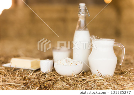 dairy products on table against the background of hay 131385277