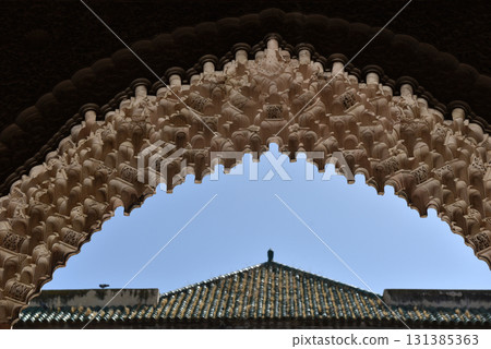 Carved stone gate arch, carved wooden archtectural details, Medersa bou Inania, Fez, Morocco 131385363