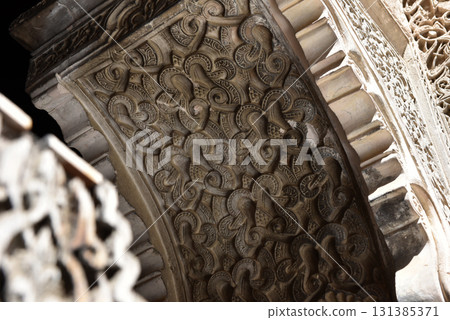 Carved stone gate arch, carved wooden archtectural details, Medersa bou Inania, Fez, Morocco 131385371