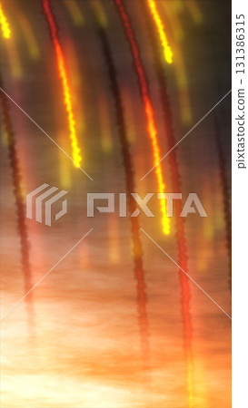 Glowing red and yellow light streaks descend against a smoky background, resembling fiery trails in the sky Glowing red and yellow light streaks descend against a smoky background, resembling fiery trails in the sky 131386315